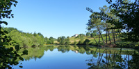 Manoir de Gurson as seen from one of the lakes © Ken Hall